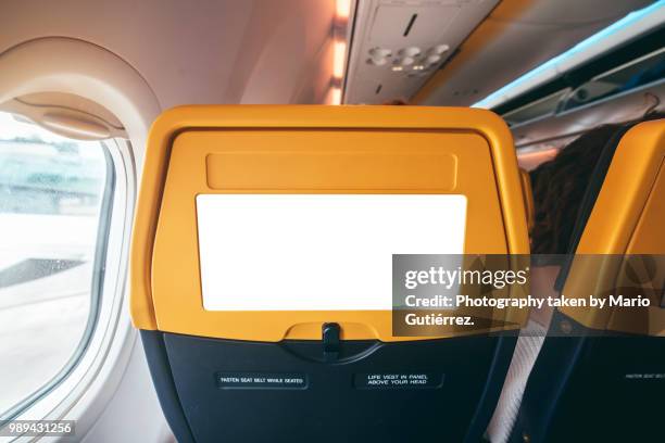 blank panel at rear of airplane seat - plane seat stockfoto's en -beelden