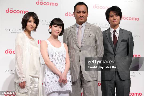 Actress Maki Horikita, singer Kaela Kimura, actors Ken Watanabe and Masaki Okada pose during the NTT DoCoMo Inc.'s new TV commercial press conference...