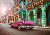 Vintage classic pink american oldtimer convertible in old town of Havana Cuba