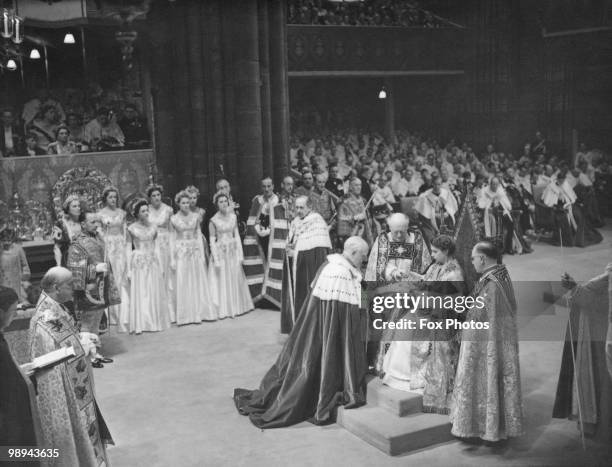 The coronation ceremony of Queen Elizabeth II in Westminster Abbey, London, 2nd June 1953. The ceremony is presided over by Archbishop of Canterbury...
