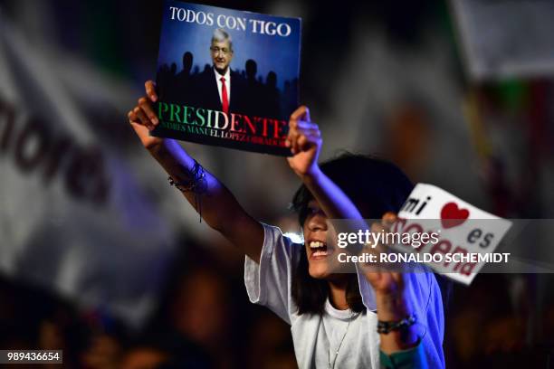 Supporters of the presidential candidate for the "Juntos haremos historia" coalition, Andres Manuel Lopez Obrador, celebrate at the Zocalo square in...