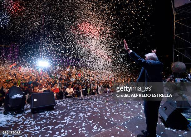 Newly elected Mexico's President Andres Manuel Lopez Obrador , running for "Juntos haremos historia" party, cheers his supporters at the Zocalo...