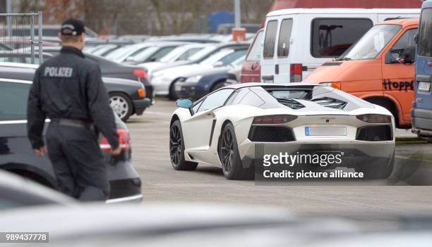 The Lamborghini of former soccer player Tim Wiese is parked at a depository of the police in Hamburg, Germany, 21 December 2017. The car was seized...