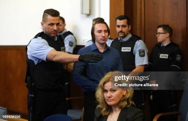 The defendant Sergej W. Is lead into a court room of the district court in Dortmund, Germany, 21 December 2017. 28-year-old Sergej W. Is accused of...