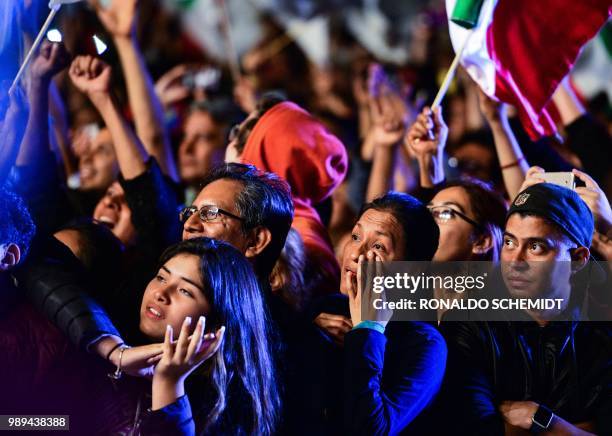 Supporters of the presidential candidate for the "Juntos haremos historia" coalition, Andres Manuel Lopez Obrador, celebrate at the Zocalo square in...