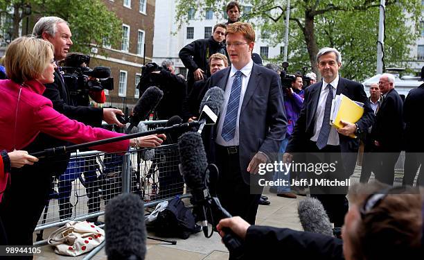 Liberal Democrat Danny Alexander, Chair of the Manifesto Group and Liberal Democrat Shadow Home Secretary, Chris Huhne arrive at the Cabinet Office...