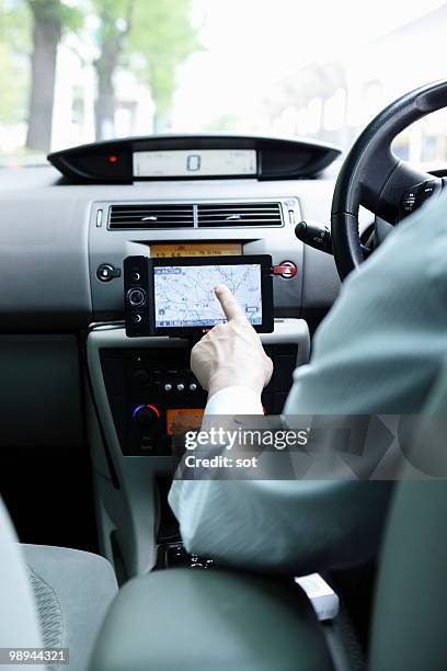 businessman using navigation system in car - newbusiness bildbanksfoton och bilder