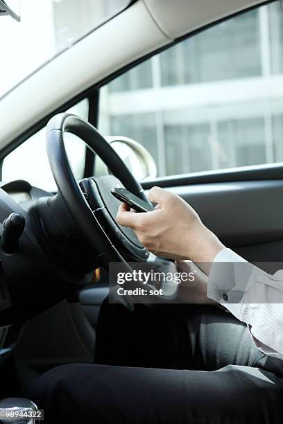 businessman using pda in car,close up - newbusiness fotografías e imágenes de stock