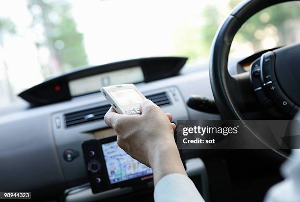 businessman using pda in car,close up - newbusiness stock pictures, royalty-free photos & images