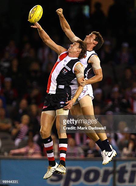 Michael Jamison of the Blues punches the ball clear of Justin Koschitzke of the Saints during the round seven AFL match between the St Kilda Saints...