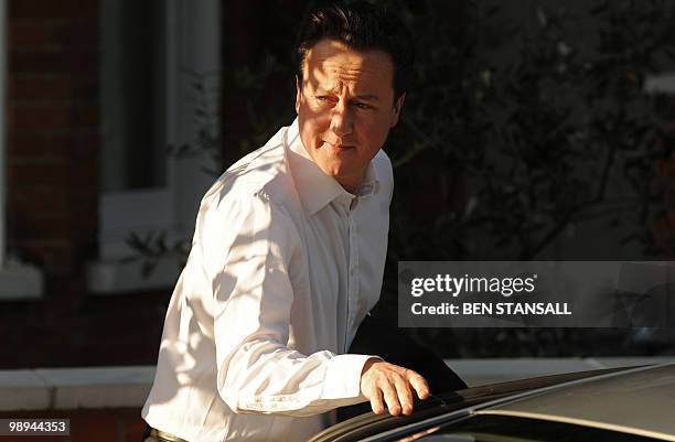 British Conservative party Leader David Cameron leaves his home in London, on May 10, 2010. Britain's main opposition parties voiced hope Monday they...