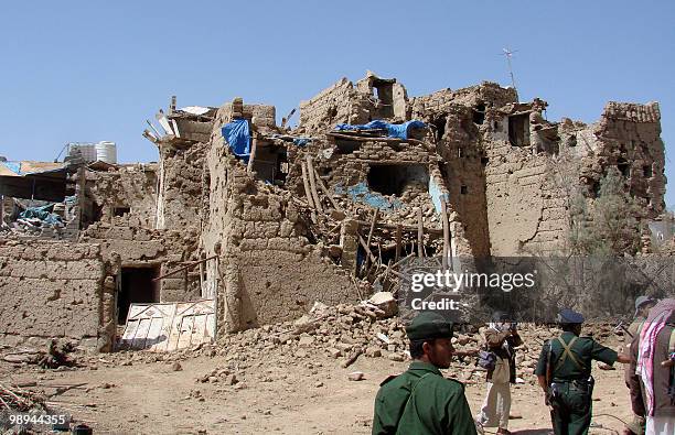 Yemeni soldiers inspect damages in Saada, north of the capital Sanaa, on February 21 ten days after a truce was declared between Shiite Huthi rebels...