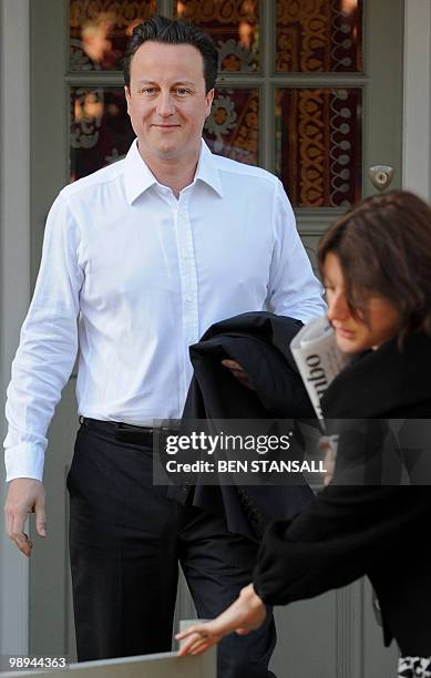 British Conservative party Leader David Cameron leaves his home in London, on May 10, 2010. Britain's main opposition parties voiced hope Monday they...