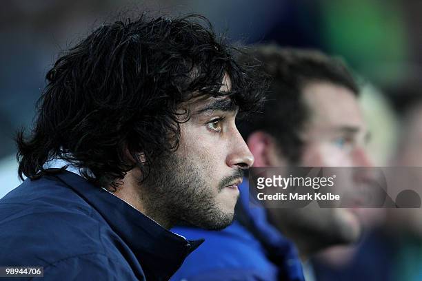 An injured Johnathan Thurston of the Cowboys watches on during the round nine NRL match between the Sydney Roosters and the North Queensland Cowboys...