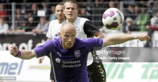 Matthias Heidrich of VfL Osnabrueck looks at the ball during the Third League match between Wacker Burghausen and VfL Osnabrueck at the Wacker...