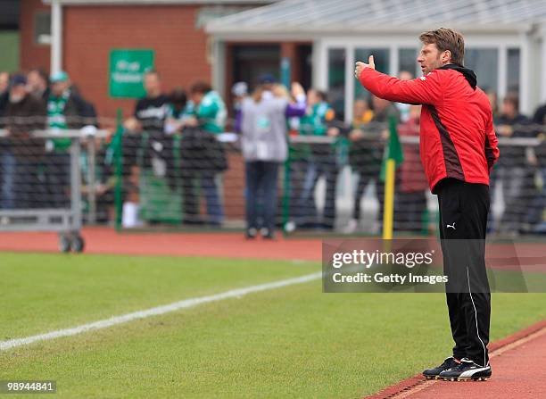 Head coach Rico Schmitt reacts during the Third League match between Werder Bremen II and Erzgebirge Aue at the "Platz 11" stadium on May 8, 2010 in...