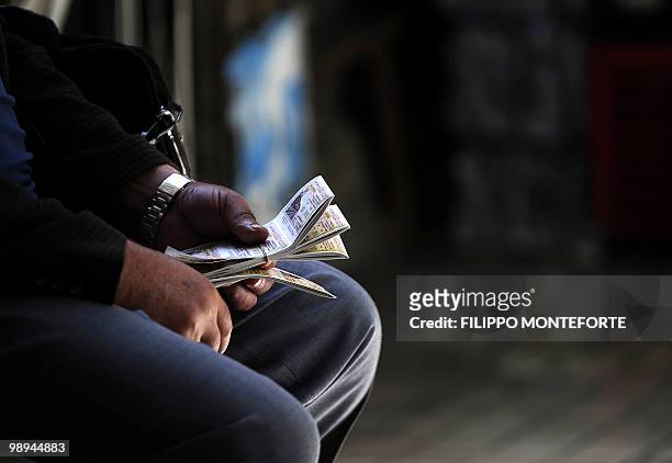 Man sells lottery tickets in downtown Athens on May 10, 2010. European nations and IMF today set up a one-trillion-dollar war chest to support the...