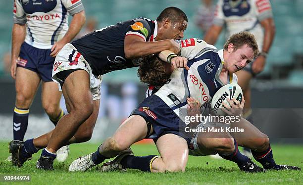 Michael Morgan of the Cowboys is tackled during the round nine NRL match between the Sydney Roosters and the North Queensland Cowboys at Sydney...