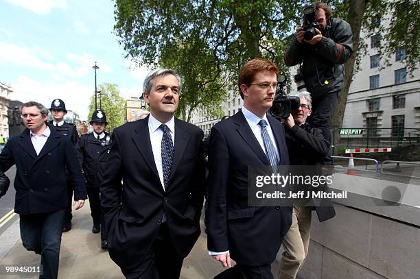 Liberal Democrat Danny Alexander, Chair of the Manifesto Group and Liberal Democrat Shadow Home Secretary, Chris Huhne walk down Whitehall following...