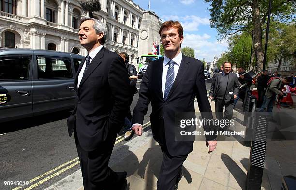 Liberal Democrat Danny Alexander, Chair of the Manifesto Group and Liberal Democrat Shadow Home Secretary, Chris Huhne walk down Whitehall following...