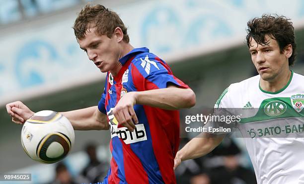 Tomas Necid of PFC CSKA Moscow wins the ball ahead of Sergey Omelyanchuk of FC Terek Grozny during the Russian Football League Championship match...