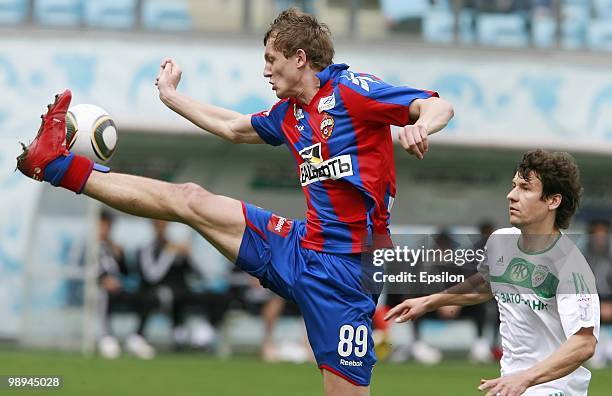 Tomas Necid of PFC CSKA Moscow wins the ball ahead of Sergey Omelyanchuk of FC Terek Grozny during the Russian Football League Championship match...