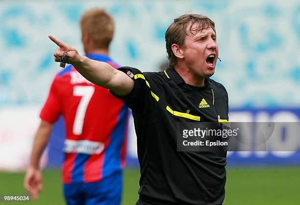 Referee Igor Egorov gestures during the Russian Football League Championship match between PFC CSKA Moscow and FC Terek Grozny at the Luzhniki...