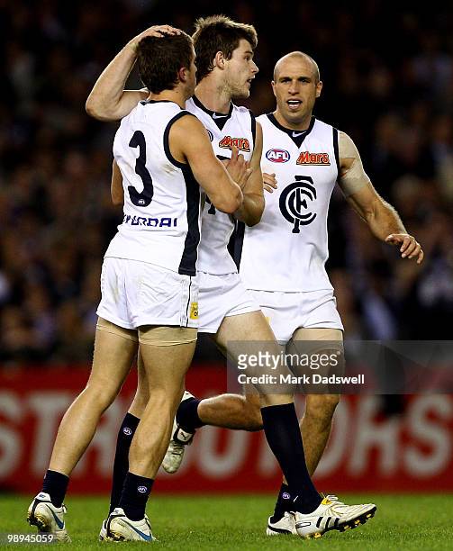 Marc Murphy and Chris Judd of the Blues celebrate a goal from Bryce Gibbs during the round seven AFL match between the St Kilda Saints and the...