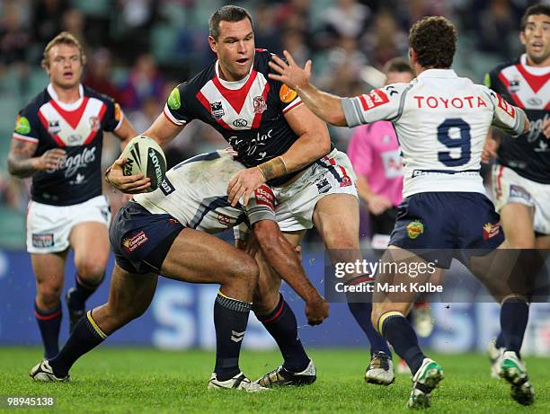 Jason Ryles of the Roosters is tackled during the round nine NRL match between the Sydney Roosters and the North Queensland Cowboys at Sydney...