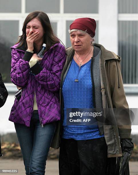 Relatives cry outside the Raspadskaya mine hit by explosions, in the city of Mezhdurechensk, in the west Siberian region of Kemerovo on May 10, 2010....