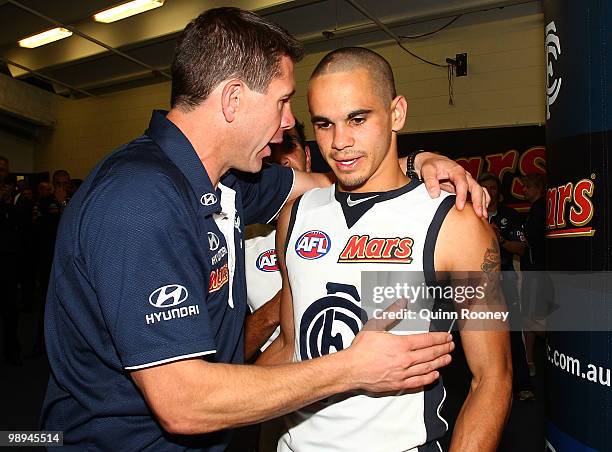 Jeff Garlett of the Blues is congratulated by his coach Brett Ratten during the round seven AFL match between the St Kilda Saints and the Carlton...