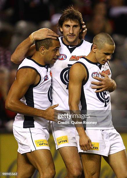 Jarrad Waite, Chris Yarran and Jeff Garlett of the Blues celebrate a goal during the round seven AFL match between the St Kilda Saints and the...