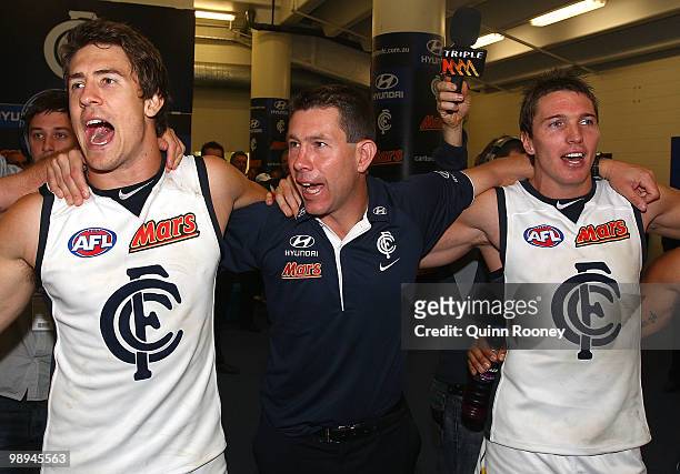 Jordan Russell, Brett Ratten and Ryan Houlihan of the Blues sing the song in the rooms after winning the round seven AFL match between the St Kilda...