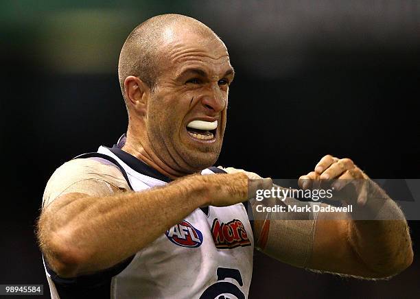 Chris Judd of the Blues indicates he has a dislocated finger during the round seven AFL match between the St Kilda Saints and the Carlton Blues at...