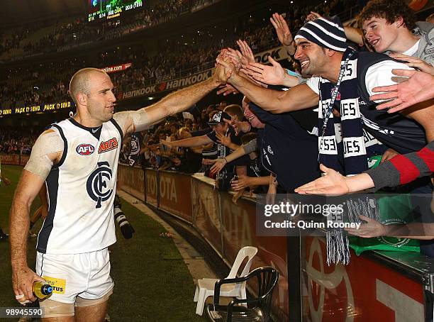 Chris Judd of the Blues celebrates with the fans after winning the round seven AFL match between the St Kilda Saints and the Carlton Blues at Etihad...