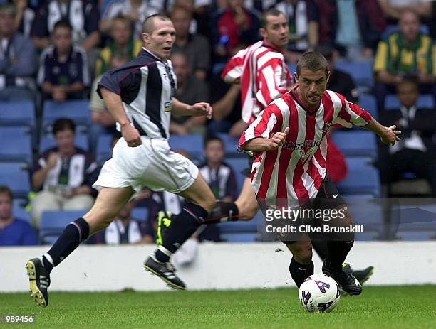 Kevin Phillips of Sunderland attempts to move away from the West Brom defence in the pre-season friendly match between West Bromwich Albion and...
