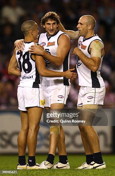 Jeff Garlett, Jarrad Waite and Chris Judd of the Blues celebrate a goal during the round seven AFL match between the St Kilda Saints and the Carlton...