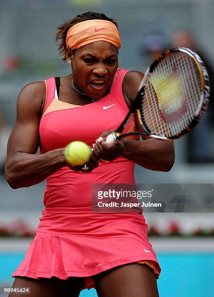 Serena Williams of the United States plays a backhand to Vera Dushevina of Russia in their second round match during the Mutua Madrilena Madrid Open...