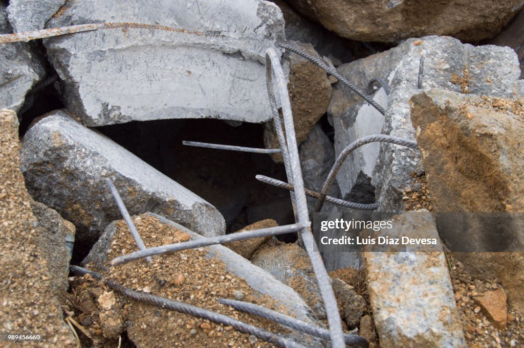 Pieces of metal and concrete by demolished