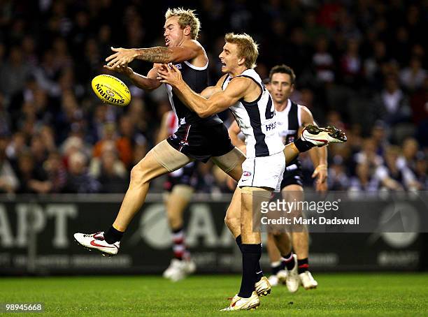Jason Gram of the Saints marks over Dennis Armfield of the Blues during the round seven AFL match between the St Kilda Saints and the Carlton Blues...
