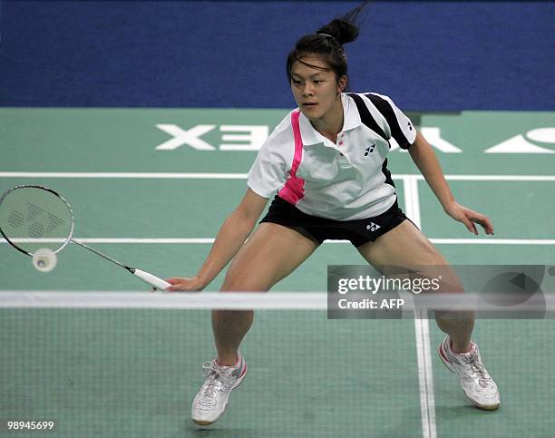 Rena Wang of the US plays a shot against Malaysia�s Wong Mew Choo during the preliminary round of Uber Cup badminton championship in Kuala Lumpur on...