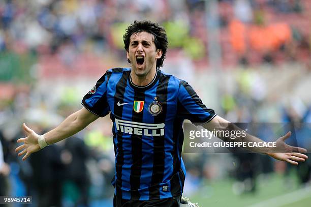 Inter Milan's Argentinian forward Alberto Milito Diego celebrates after scoring against Chievo during their Serie A football match at San Siro...