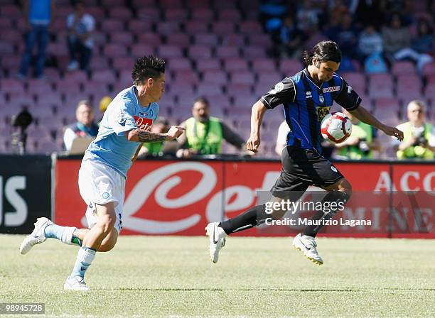 Marek Hamsik of SSC Napoli battles for the ball with Fabio Ceravolo of Atalanta BC during the Serie A match between SSC Napoli and Atalanta BC at...
