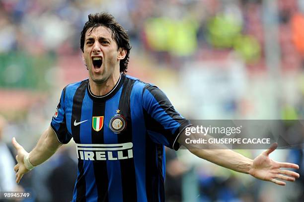 Inter Milan's Argentinian forward Alberto Milito Diego celebrates after scoring against Chievo during their Serie A football match at San Siro...
