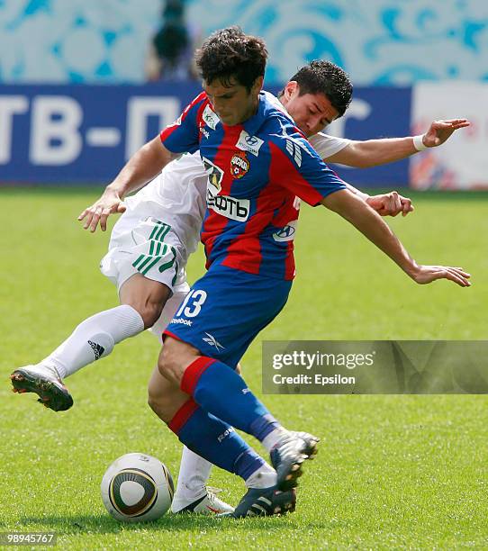 Mark Gonzalez of PFC CSKA Moscow battles for the ball with Juan Carlos Arce of FC Terek Grozny during the Russian Football League Championship match...