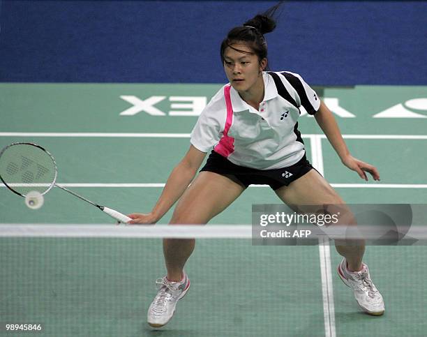 Rena Wang of the US plays a shot against Malaysia�s Wong Mew Choo during the preliminary round of Uber Cup badminton championship in Kuala Lumpur on...