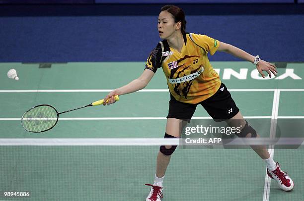 Malaysia�s Wong Mew Choo plays a shot against Rena Wang of the US during the preliminary round of the Thomas Cup badminton championship in Kuala...