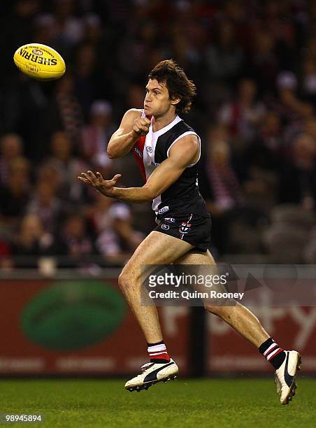 Farren Ray of the Saints handballs during the round seven AFL match between the St Kilda Saints and the Carlton Blues at Etihad Stadium on May 10,...