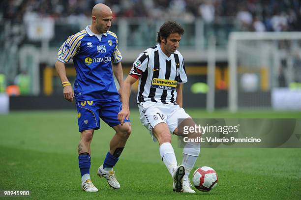 Alessandro Del Piero of Juventus FC is challenged by Francesco Valiani of Parma FC during the Serie A match between Juventus FC and Parma FC at...