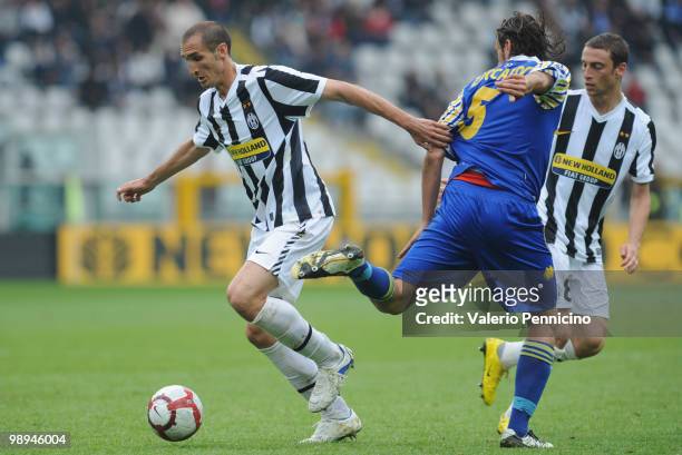 Giorgio Chiellini of Juventus FC competes for the ball with Christian Zaccardo of Parma FC during the Serie A match between Juventus FC and Parma FC...